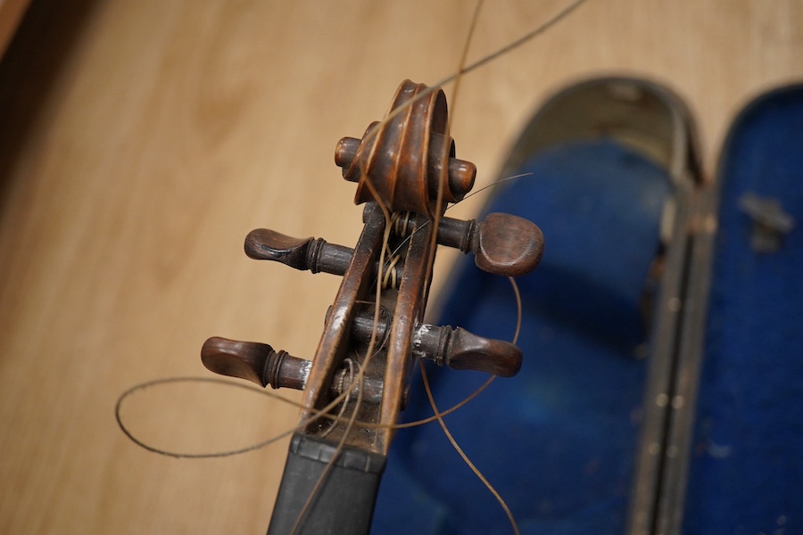 Two cased violins; one French 19th century bearing a hand written label for Francesco Werentle 1746, body length 35.5cm, the other an early 20th century violin, body length 35cm. Condition - poor.